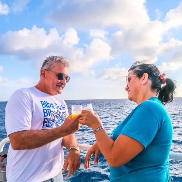 a man holding a glass of water