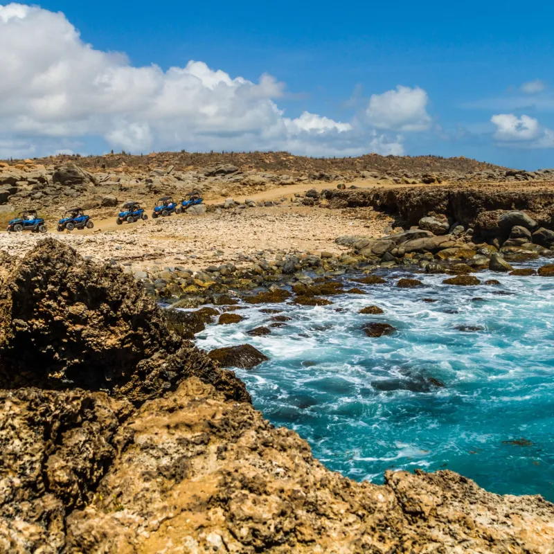 a rocky beach next to a body of water