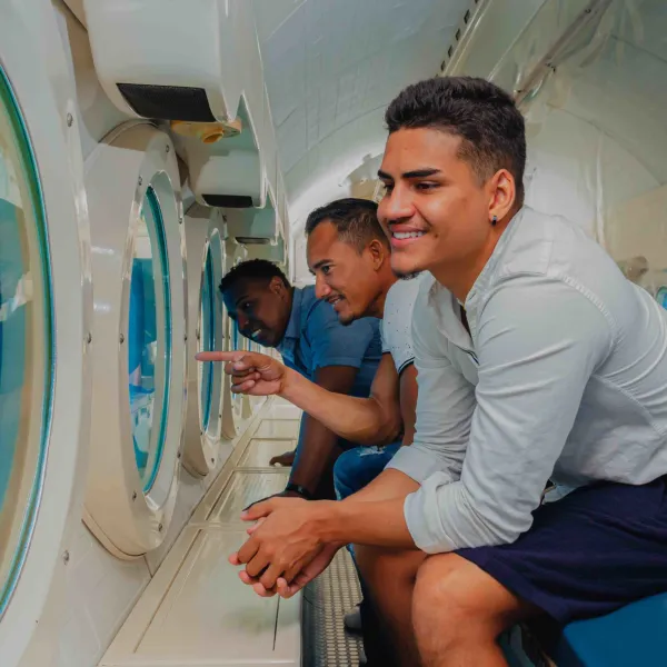 a man standing in front of a mirror posing for the camera