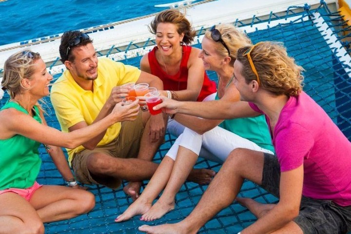 a group of people sitting in a pool of water