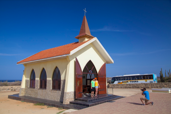 a small clock tower in front of a building