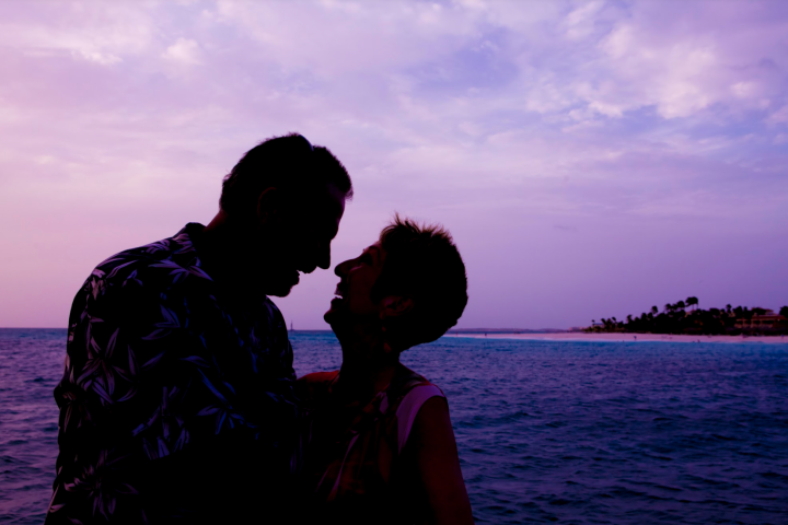 a person standing next to a body of water