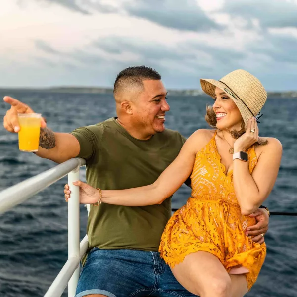 a man standing next to a body of water