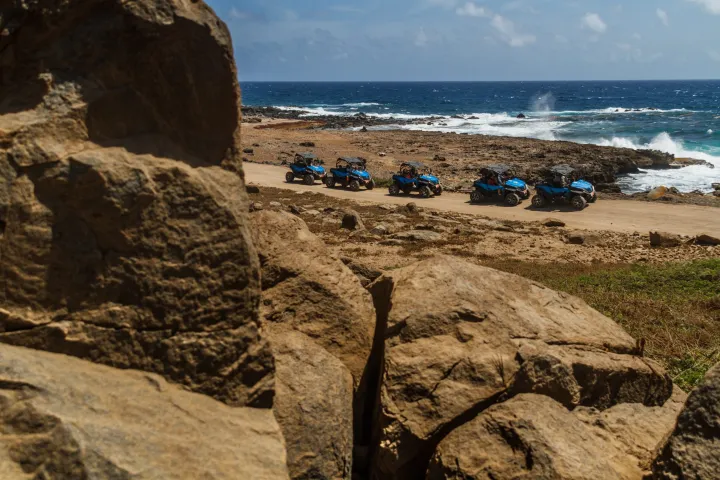 a rocky beach next to the ocean