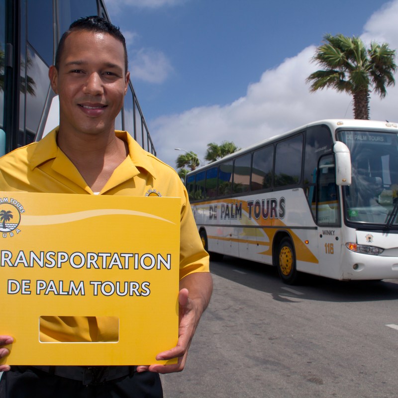 a person standing in front of a bus