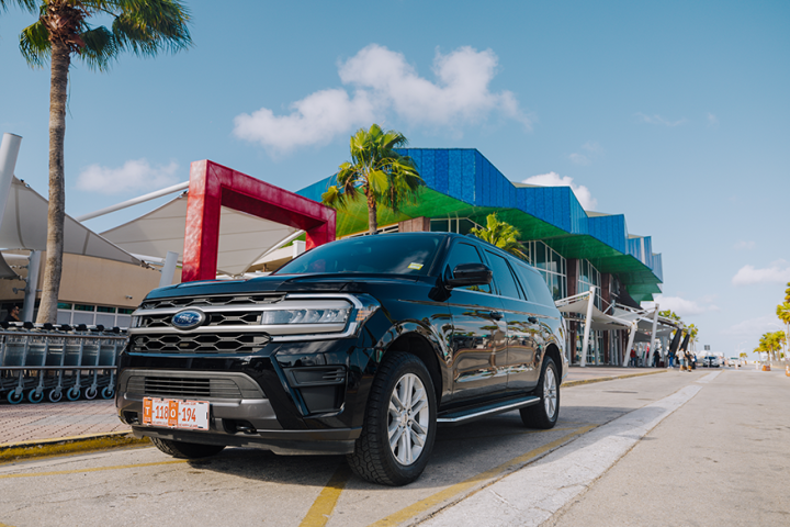 a truck is parked in front of a car