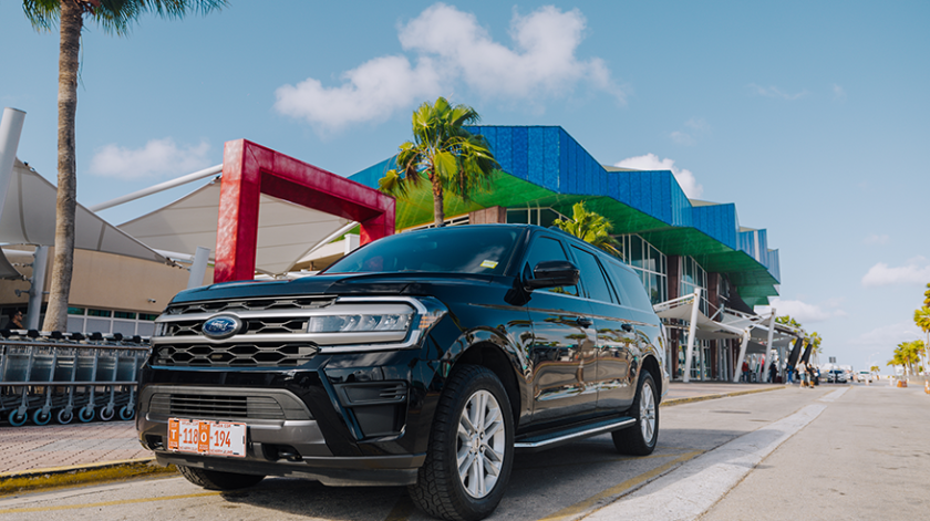 a truck is parked in front of a car