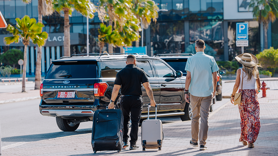 attending of de palm tours helping for black car for private transfer