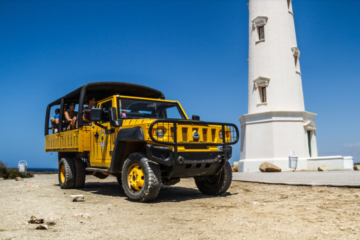 a truck driving down a dirt road