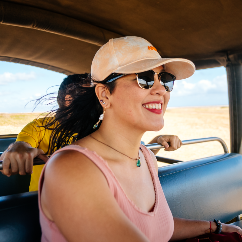 a woman wearing sunglasses driving a car
