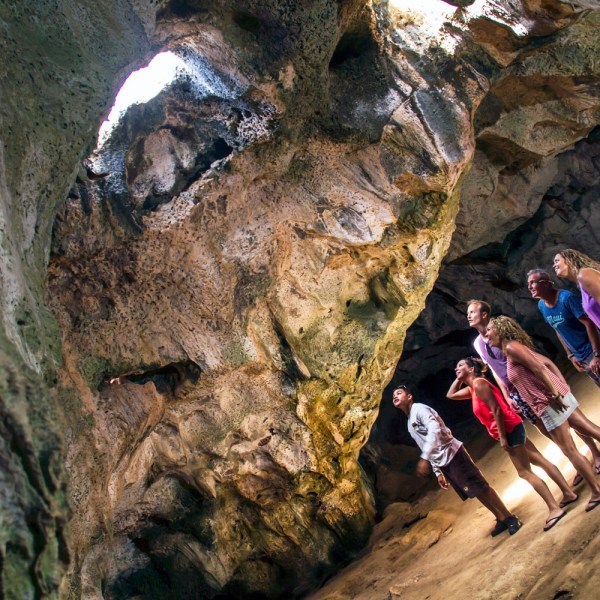 a person sitting on a rock