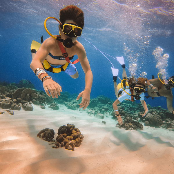 a man riding a wave on a surfboard in the water