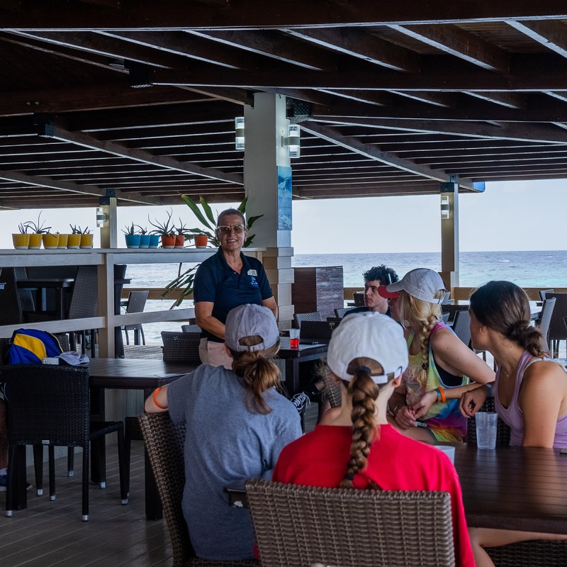 a group of people sitting at a table