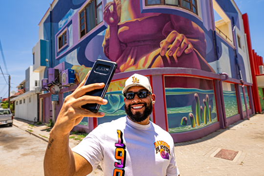 taking pictures during de palm tours jeep tour safari through san nicolas street art