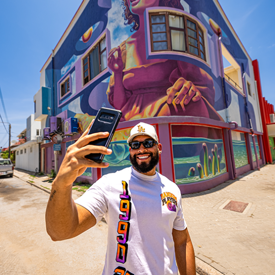 taking pictures during de palm tours jeep tour safari through san nicolas street art