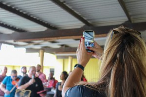 a woman standing in front of a crowd