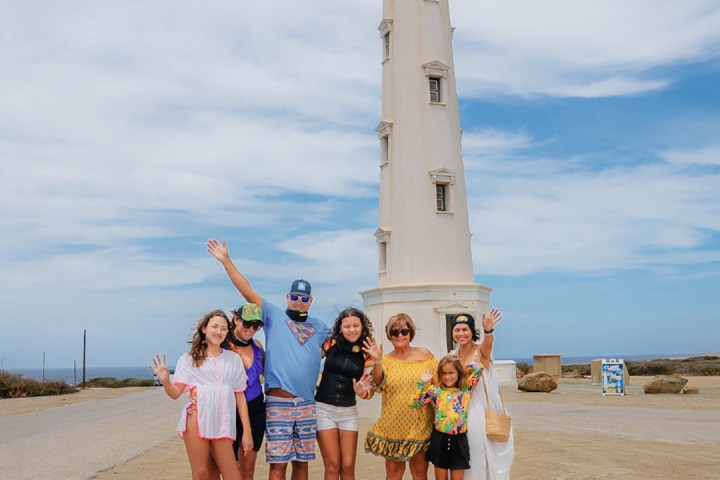 de palm tour' tour guide helping take picture at california lighthouse