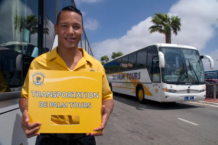 a person standing in front of a bus
