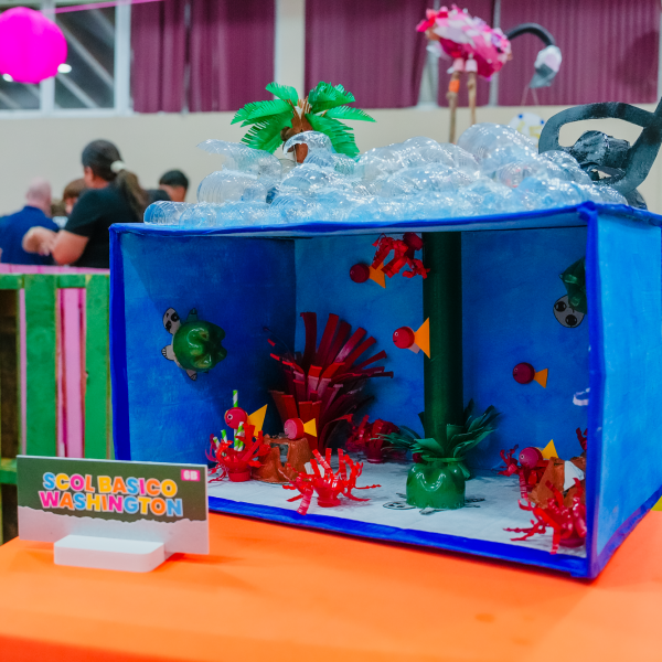 a group of people sitting at a table with a laptop