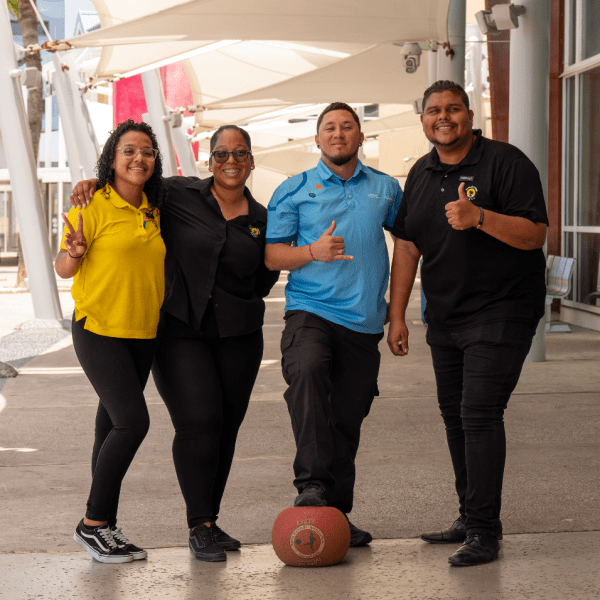 a man and a woman standing in front of a building